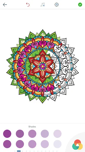 Symmetrical green and pink mandala coloring page with purple shade palette options and color wheel picker displayed