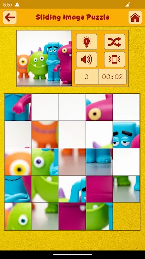 Sliding puzzle game in progress showing colorful toy character pieces partially assembled with game controls and timer display