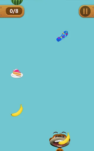 Talking Monkey food collection mini-game with falling cake, skateboard and banana on light blue background, score tracker showing 0 of 8